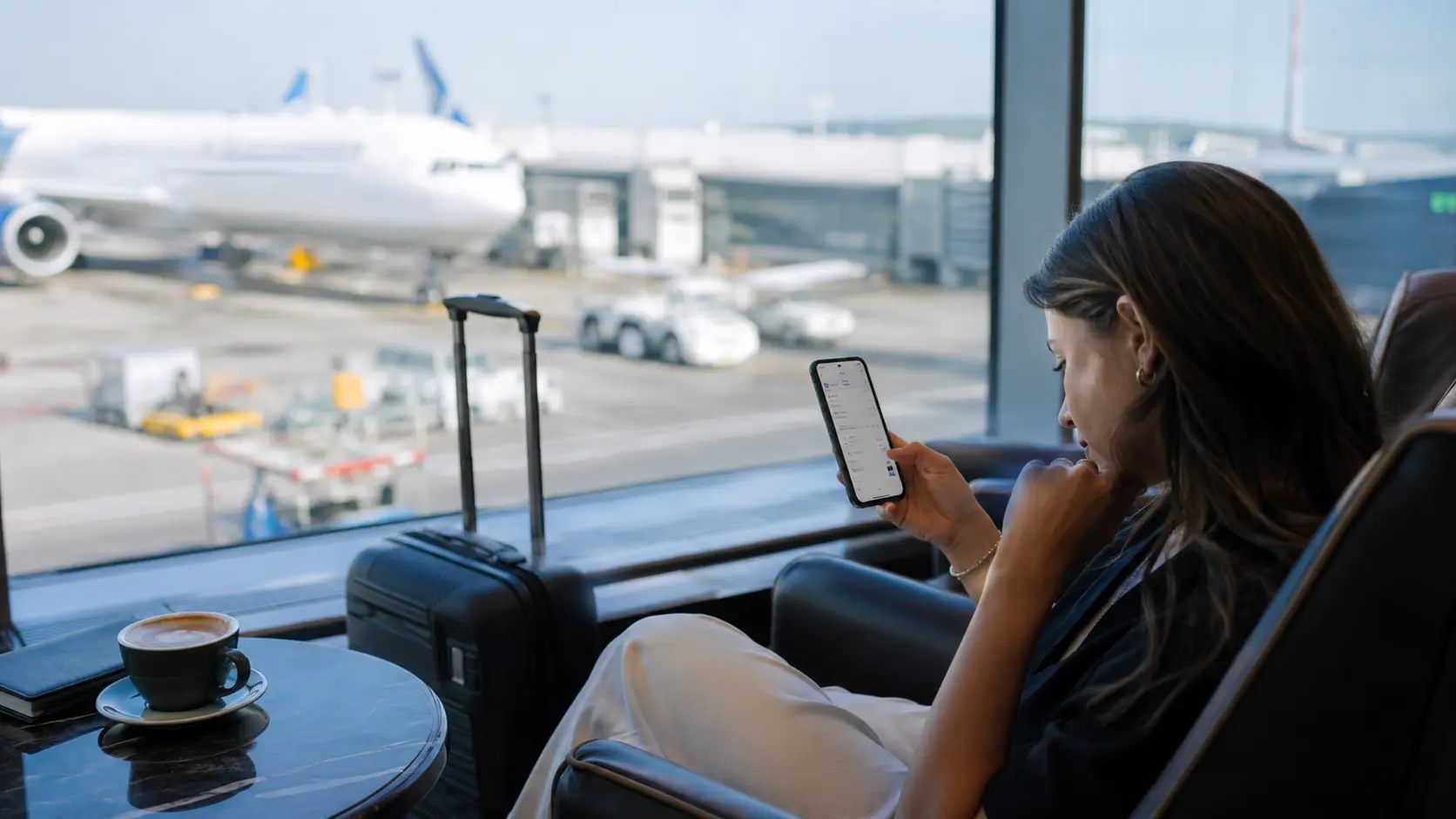 Is Kiwitaxi Safe and Worth It? 2026 Kiwitaxi Review & User Ratings 1 Kiwitaxi review 2026 โ arrival hall luggage trolley searching for driver