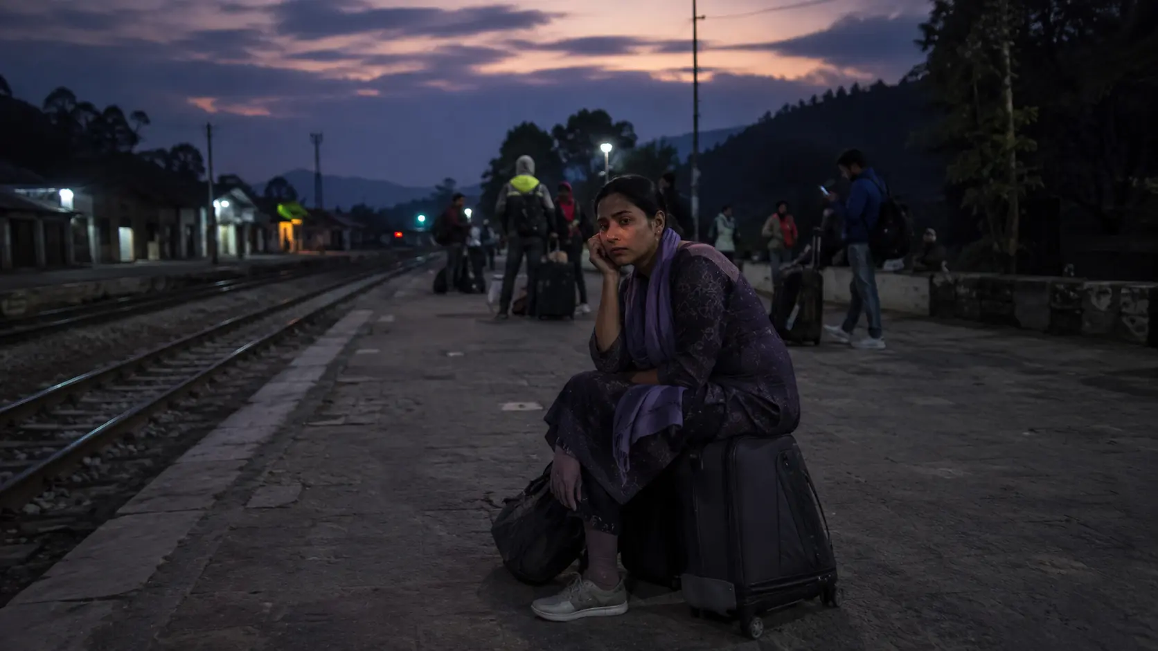 10 Worst Train Journeys You Must Avoid Globally 8 Worst train journeys 2026 — passengers facing a long delay at a remote station at dusk